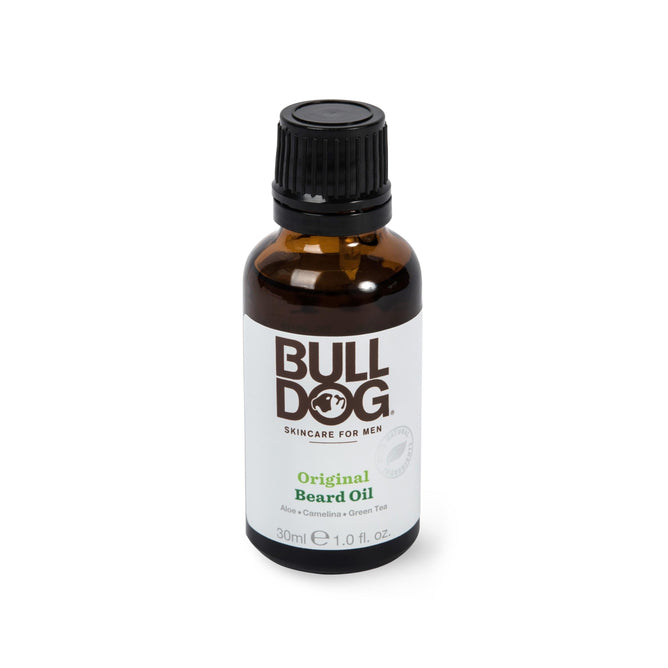 Bulldog Beard Oil contains aloe vera, camelina, and green tea for nourishing facial hair. The brown 30 ml (1.0 fl oz) bottle with a black cap houses essential oils to maintain healthy beards.