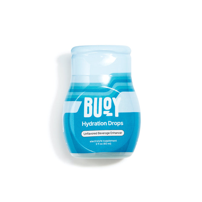 A blue and white Hydration Drops - Unsweetened Electrolytes for Any Beverage bottle by Buoy Hydration stands against a white backdrop. Labeled Unflavored Beverage Enhancer and electrolyte supplement 2 fl oz (60 ml), its your ideal trace minerals boost.