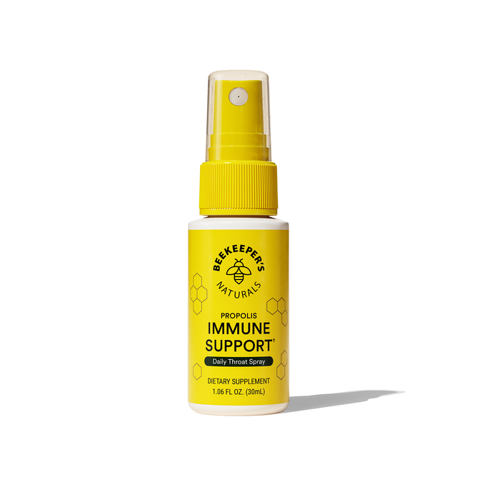 A yellow spray bottle labeled Beekeeper’s Naturals Propolis Immune Support Throat Spray (VIP Discount), with bee propolis and hexagon graphics, stands upright on a white background.