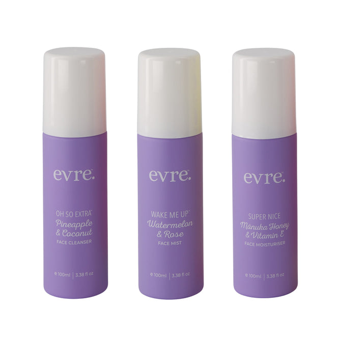 Three purple evre. skincare bottles with white caps stand in a row. From left to right, the 100ml Starter Set includes: Pineapple & Coconut Face Cleanser, Watermelon & Rose Face Mist, and Mānuka Honey & Vitamin E Face Moisturiser, designed for a refreshing experience and skin vitality.