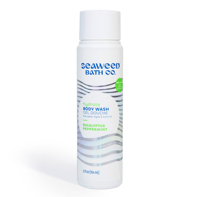 The Seaweed Bath Cos Hydrating Cleansing Body Wash, in a white bottle with wavy lines, features nutrient-rich oils and ingredients such as seaweed extract, blue-green algae, and kukui oil. It contains 12 fl oz (354 mL) with eucalyptus and peppermint scents.