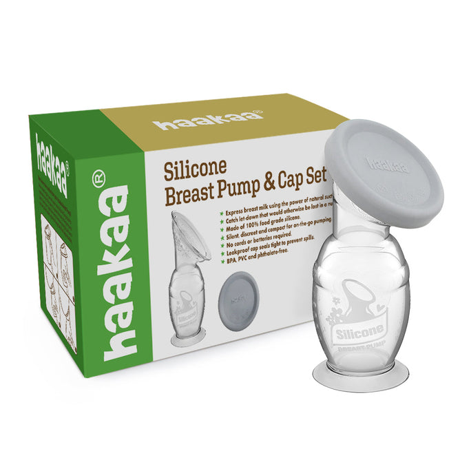 The Haakaa Generation 2 Silicone Breast Pump with Lid is displayed in a green and white box, featuring the clear silicone pump with a gray cap. The packaging emphasizes its construction from 100% food-grade materials, free from BPA, PVC, and phthalates.