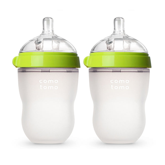 The Comotomo Baby Bottle 2-Pack features green lids, clear silicone nipples, and soft squeezable bases. Designed from 100% food-grade silicone to mimic breastfeeding for an easy transition, these bottles also include anti-colic vents to ensure your little ones comfort.