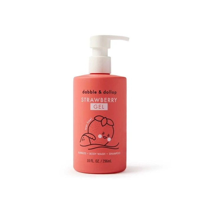 A 10 fl. oz/296 mL red bottle of Dabble & Dollops 3-in-1 Gel Shampoo, Body Wash & Bubble Bath with a pump dispenser. The label shows a natural strawberry character lounging and highlights its tear-free formula.