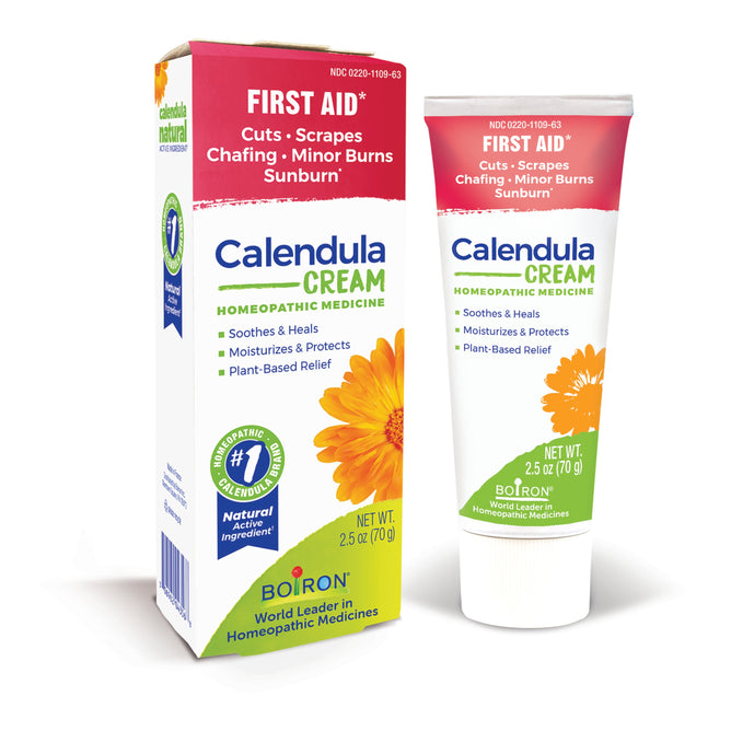 The Boiron Calendula Cream, a 2.5 oz (70 g) tube and box featuring an orange flower, provides natural homeopathic relief for skin irritations like cuts, scrapes, chafing, minor burns, and sunburn with plant-based ingredients.