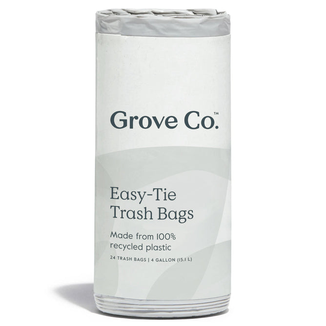 The Grove Co. 100% Recycled Plastic Trash Bags are shown with easy-tie tops. The package includes 24 bags, each with a 4-gallon capacity, all in a simple gray design.