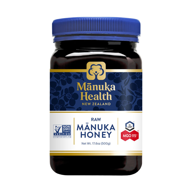 A 17.6 oz jar of Manuka Healths Raw Manuka Honey, MGO 115+/UMF 6+ from New Zealand, features a blue lid and certification logos on its label, embodying purity and quality.