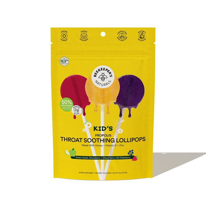 Beekeepers Naturals Kids Throat Soothing Lollipops come in a yellow package with colorful lollipop graphics, featuring propolis extract, vitamin D, zinc, and elderberry. They offer 50% less sugar and only 25 calories per pop.