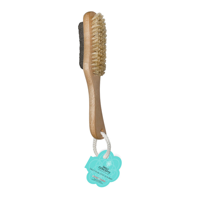 Discover the Daily Dual Foot Scrubber by Daily Concepts, a top-tier exfoliating tool featuring bristles on one side and a pumice stone foot scrubber on the other. It includes a turquoise tag with a floral design, attached via a looped white string.