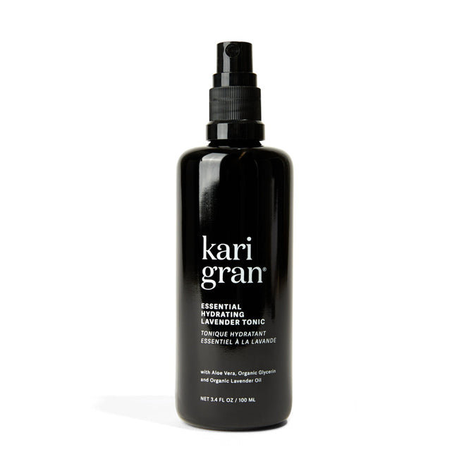 The black Kari Gran Essential Hydrating Tonic spray bottle rehydrates skin and maintains the moisture barrier. It contains aloe vera, organic glycerin, and organic lavender oil. The bottle size is 3.4 fl. oz (100 ml).