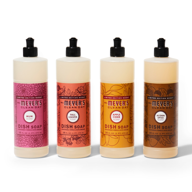 The Mrs. Meyer’s Fall Dish Soap Collection features four bottles with seasonal scents—Mum, Fall Leaves, Apple Cider, and Acorn Spice—arranged side by side on a white background.