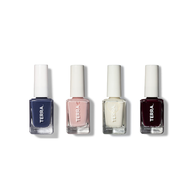 Four bottles from Terra Beauty Bars Best Seller Nail Collection stand against a white backdrop. Displaying dark blue, light pink, off-white, and deep burgundy shades, these vegan nail polishes promise a stunning and cruelty-free manicure.