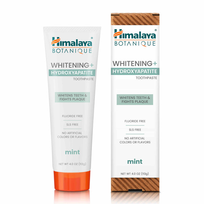 Image of a tube and box of Himalaya Whitening+ Hydroxyapatite Toothpaste in mint flavor, featuring whitens teeth & fights plaque, fluoride free, and SLS free on the packaging, with no artificial colors or flavors.