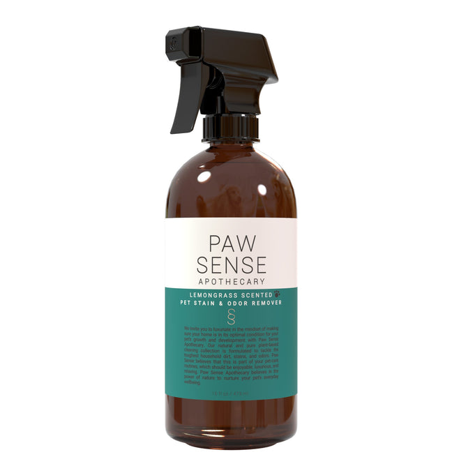 The Paw Sense Pet Stain & Odor Remover comes in a brown spray bottle with a black nozzle, featuring a Lemongrass scent. Its teal and white design highlights eco-friendly, pet-safe cleaning using natural essential oils, ideal for your pet grooming supplies collection.