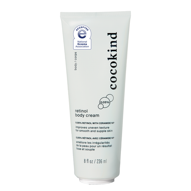 Cocokinds Retinol Body Cream in an 8 fl oz white tube, enriched with ceramide NP and squalane, is a luxurious moisturizer that enhances skin texture and is certified by the National Eczema Association.