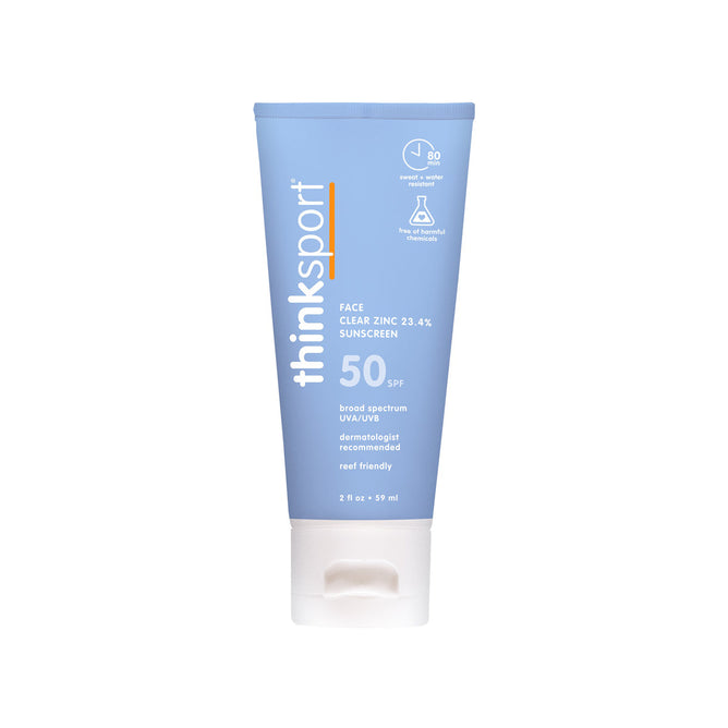 A blue tube of thinksun thinksport SPF 50 Clear Zinc Active Face sunscreen with a white cap. The label features its chemical-free, reef friendly formula, broad-spectrum UVA/UVB protection, and up to 80 minutes water resistance.