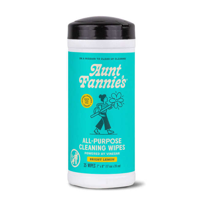 Aunt Fannies Cleaning Vinegar Wipes come in a cylindrical container with a turquoise retro-style label. Powered by vinegar and essential oils, they feature a bright lemon scent, are biodegradable, and include 35 wipes measuring 7x11 inches each.