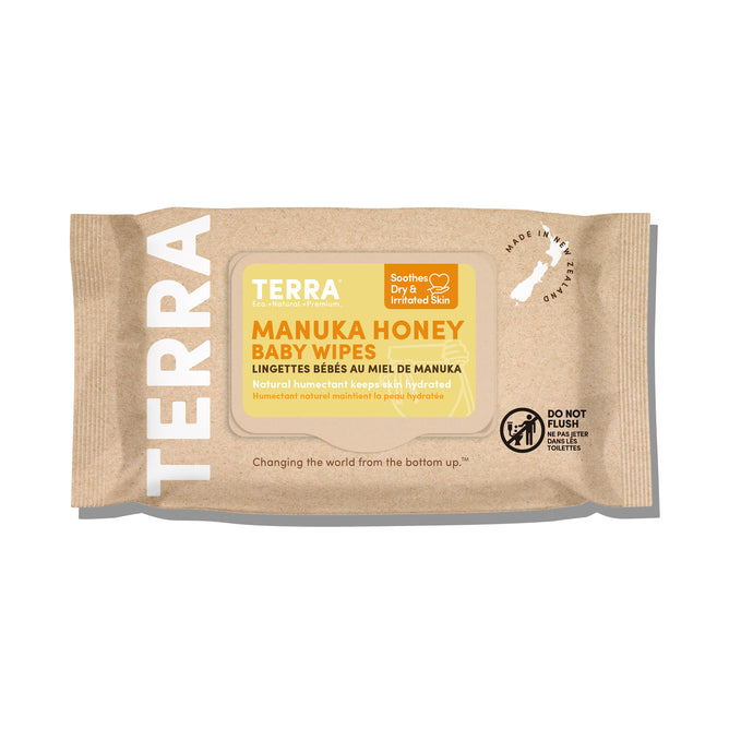 Terras Baby Wipes with Manuka Honey provide soothing care for dry, sensitive skin in beige packaging that emphasizes moisturizing benefits. The package notes not to flush the wipes and features a New Zealand map icon to denote its origin.
