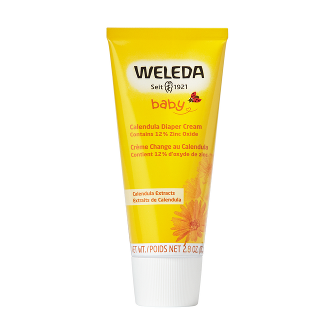 A yellow tube of Weleda Diaper Cream with a white cap features baby, Seit 1921, and product details, alongside a calendula flower image at the bottom. Its 2.8 oz / 81 g, part of Calendula Baby Care, and eligible for TerraCycle recycling.