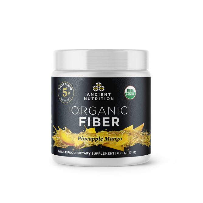 Ancient Nutritions Organic Fiber Powder features a pineapple mango flavor with a black and white label design. It highlights key ingredients like acacia fiber and konjac root, boasts the USDA Organic label, and emphasizes 5g of fiber blend per serving.