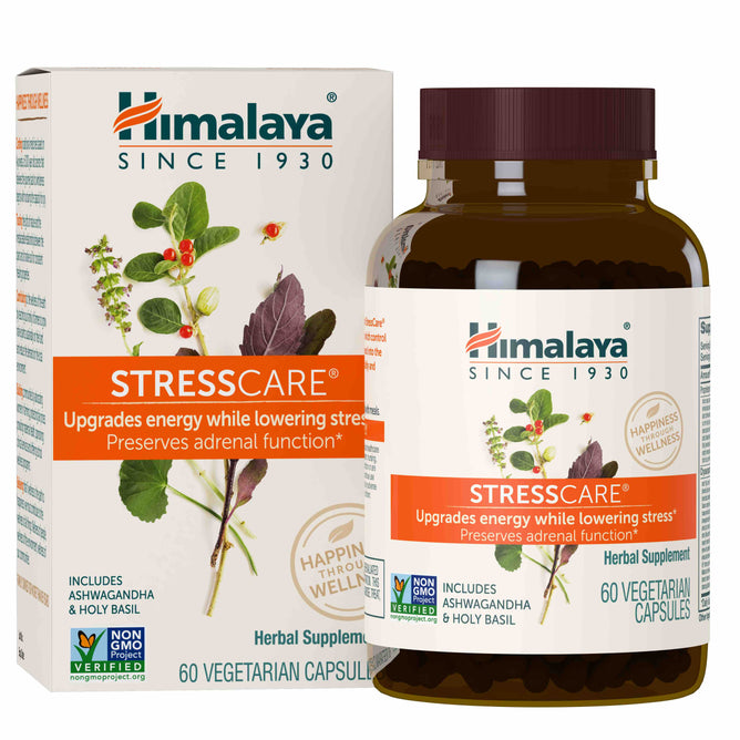 A bottle of Himalayas Stress Care herbal supplement capsules is next to its packaging adorned with botanical illustrations, highlighting adaptogens like ashwagandha and holy basil for energy boosting and stress reduction benefits.