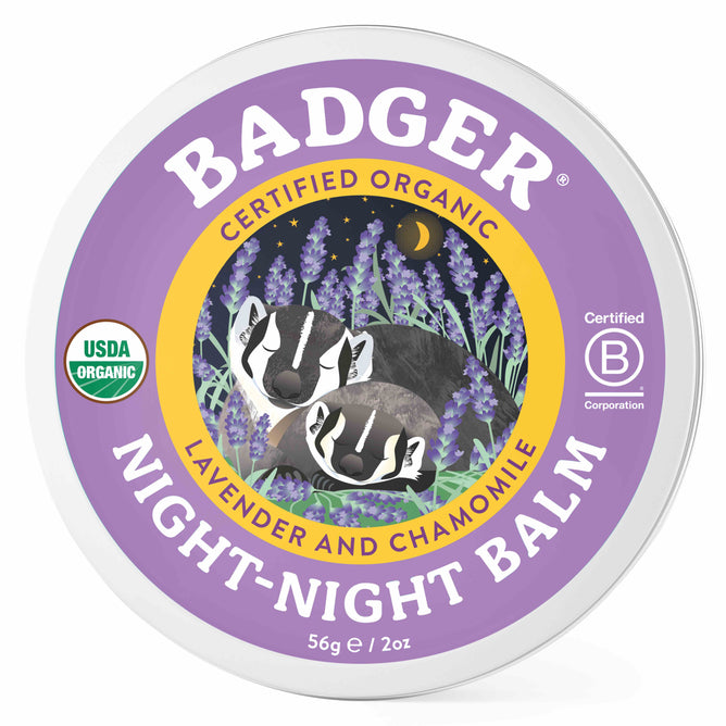 Badger Balms Night Night Balm comes in a circular tin featuring two badgers among lavender and chamomile under a starry sky. It is certified organic, perfect for kids aromatherapy, and includes USDA Organic and Certified B Corporation on the label.
