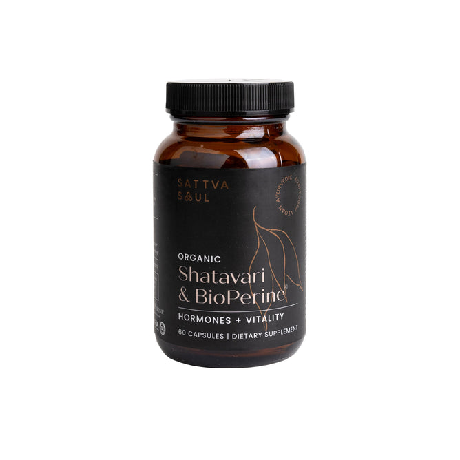 The Sattva Soul bottle contains 60 capsules of Organic Shatavari & Bioperine, aimed at womens hormonal health and balance. Its minimalist white and gold label emphasizes vitality and wellness.