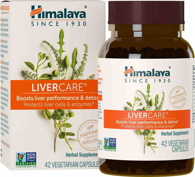 The image displays a Himalaya LiverCare herbal supplement bottle and box, featuring Ayurvedic herbs. The white packaging with green and orange accents includes herb images and highlights benefits such as supporting liver performance, bile production, and detoxification. Contains 42 capsules.