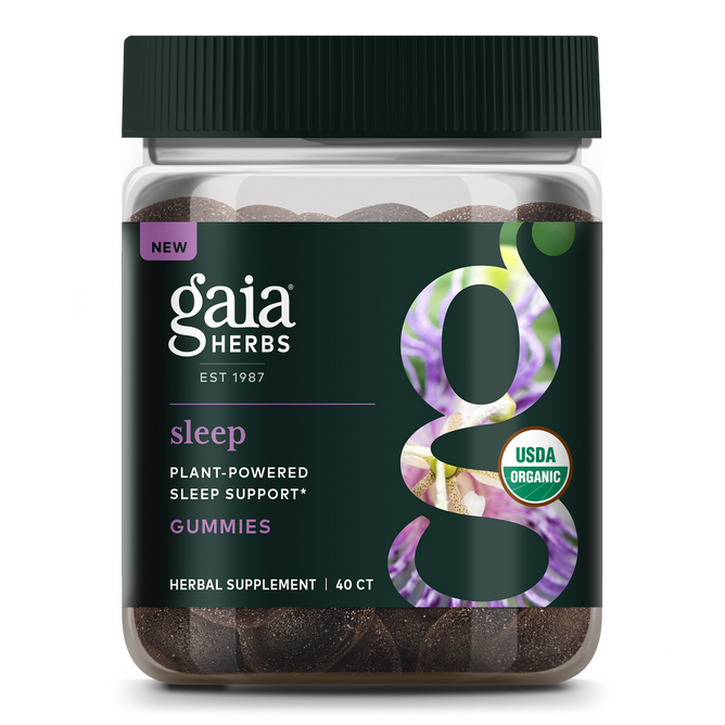 A jar of Gaia Herbs Sleep Gummies with a bold g on the label contains 40 gummies. The dark, botanically decorated label highlights USDA Organic, Plant-Powered Sleep Support, and calming Ashwagandha for restful sleep.