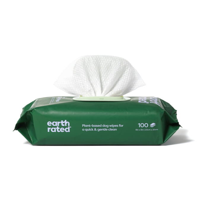 A green package of Earth Rateds hypoallergenic Large Dog Grooming Wipes, ideal for natural pet care, features an open top with a visible wipe. This plant-based option includes 100 wipes, each 8 inches square.