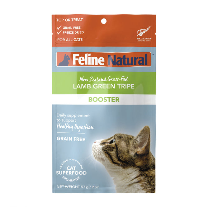 The image features Feline Naturals Grain-Free Freeze-Dried Cat Food Supplement with a tabby looking up. This lamb green tripe booster, from the Freeze-Dried Boosters line, aids healthy digestion and weighs 57g (2 oz).
