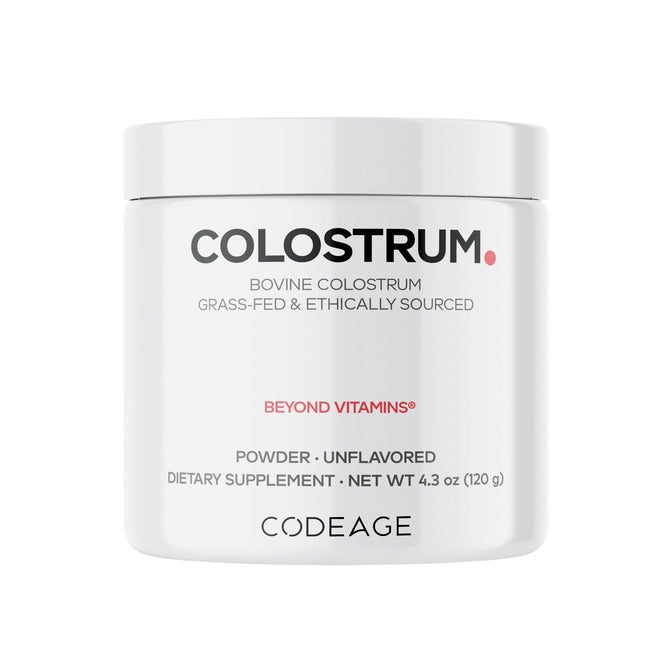 A 4.3 oz (120 g) white container of Codeage Colostrum Powder, grass-fed and bioavailable, unflavored with Beyond Vitamins label.