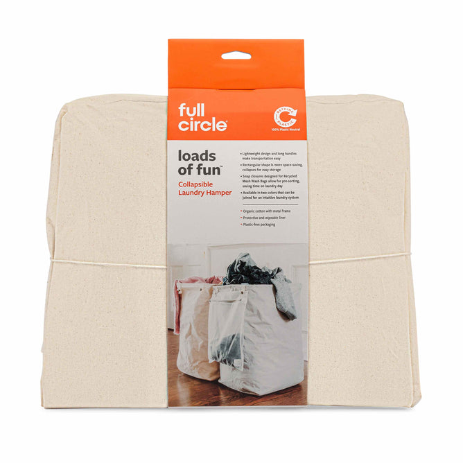 The Organic Cotton Laundry Hamper by Full Circle features loads of fun packaging, showcasing the hamper sorting clothes. It highlights eco-friendly beige fabric thats lightweight, easily stored, and portable.