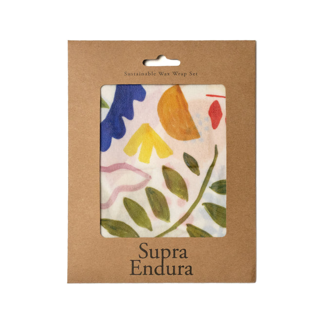 A brown cardboard package labeled Supra Endura displays eco-friendly Beeswax Wraps (VIP Discount)—reusable wax wraps with a colorful abstract floral design visible in a window. Text at the top reads Sustainable Wax Wrap Set.