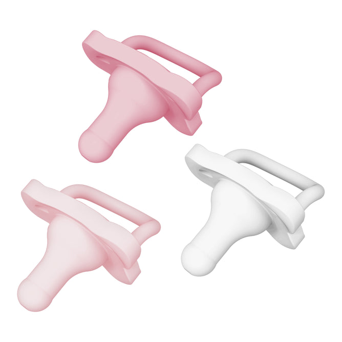 Dr. Browns HappyPaci set includes three butterfly-shaped pacifiers with looped handles and rounded nipples, crafted from 100% silicone for easy cleaning: two in pink placed top left and bottom right, and one in white at the bottom center, suitable for ages 0-6 months.