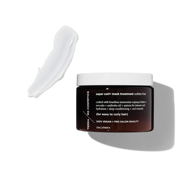 An open jar of Terra Beauty Bars Curl+ Mask Treatment reveals its creamy white texture on a pristine backdrop. This vegan, sulfate-free hair mask is ideal for wavy to curly hair. The dark jar with crisp white text creates a striking appearance.