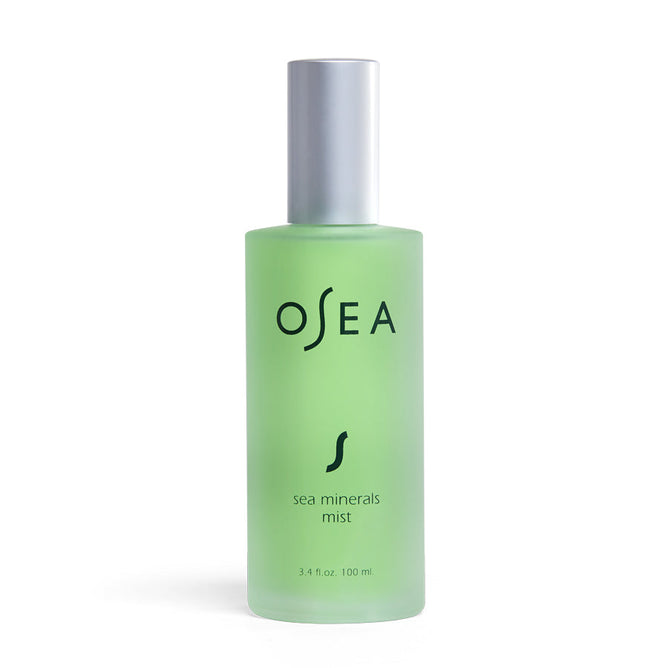 A 3.4 fl oz (100 ml) green frosted glass bottle with a silver cap features OSEA and Sea Minerals Mist in black text, offering a refreshing toning mist experience.