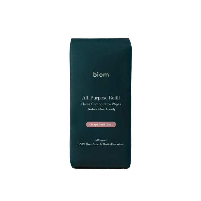 A dark green pack of Biom All-Purpose Wipe Refills, labeled Home Compostable Wipes, features a refreshing Grapefruit Zest scent. Each pack contains 60 naturally derived, 100% plant-based, plastic-free wipes.