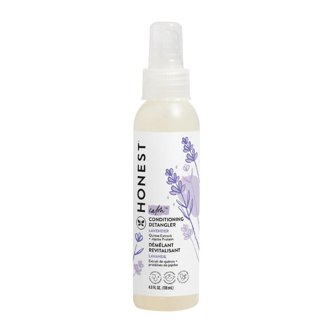 A spray bottle of The Honest Companys Conditioning Detangler features a calming lavender scent, adorned with lavender illustrations and a clear cap. The front label displays product details in black text on a white background, promising silky-smooth strands.