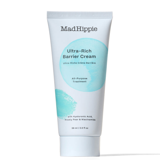 A white tube of Mad Hippie Ultra Rich Barrier Cream features light blue circles and the text showcasing hyaluronic acid, antioxidant-rich hydration, prickly pear, and niacinamide for all-purpose treatment. The tube is 50 ml/2.0 fl oz.