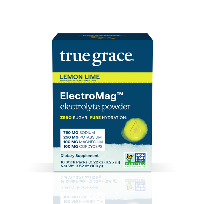 A box of True Graces ElectroMag™ electrolyte powder in lemon lime flavor includes 16 non-GMO verified stick packs. Each sachet focuses on hydration with 750 mg sodium, 250 mg potassium, 100 mg magnesium, and an added boost of 100 mg cordyceps, all while being zero sugar.