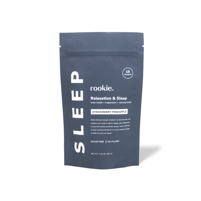 Rookie Wellness offers the Sleep + Relaxation supplement in a sleek dark grey standing pouch. This sugar-free strawberry pineapple nightcap contains magnesium and sleep-supporting herbs for brain health, with 15 packets included.