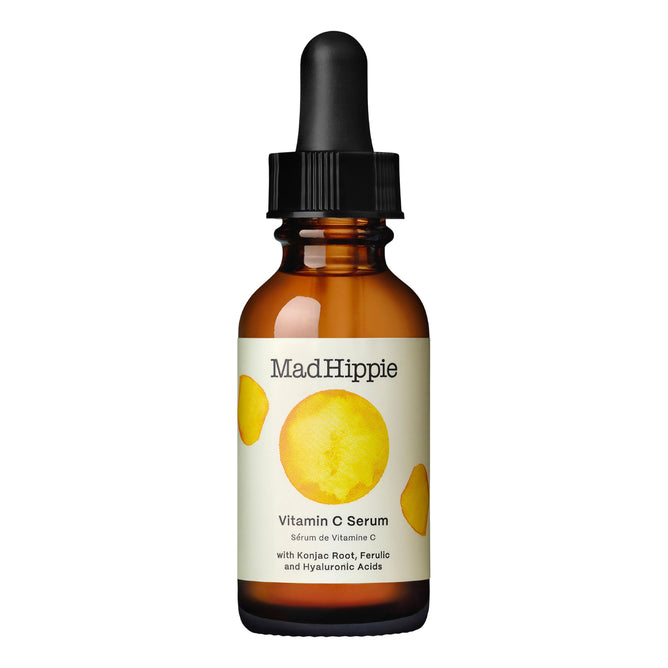 The Mad Hippie Vitamin C Serum comes in a brown glass bottle featuring yellow circle accents and a black dropper cap. It contains potent antioxidants from Konjac Root along with Ferulic and Hyaluronic Acids, enhancing skin radiance.