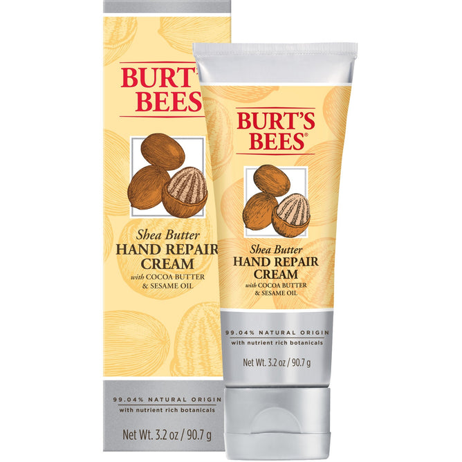 Burts Bees Shea Butter Hand Repair Cream, 3.2 oz (90.7 g), is displayed beside its packaging. The label highlights cocoa butter and sesame oil for moisturizing, with 99.04% natural origin ingredients for gentle hand care.