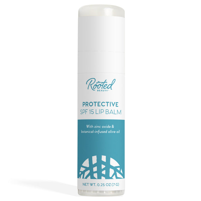A cylindrical tube of Rooted Beauty Protective Lip Balm with SPF 15 - Mint Flavor is depicted. The label reads With reef-friendly zinc oxide & botanical-infused olive oil and features a teal and white design with a geometric pattern at the bottom.
