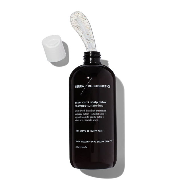 An open black bottle with TERRA RG COSMETICS reveals a blob of Curl+ Scalp Detox Scrub by Terra Beauty Bars. Enriched with Brazilian superfoods, it promises 100% VEGAN, pro salon quality results for your hair care routine.