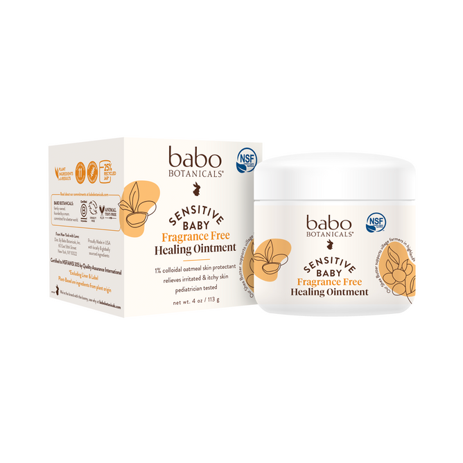 Image of Babo Botanicals Sensitive Baby All Natural Healing Ointment. The jar and box feature an oat plant illustration and NSF logo, emphasizing its organic skin protection. Ideal as a natural baby ointment, it provides soothing eczema relief for delicate skin.