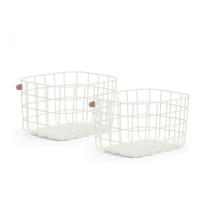 Two Open Spaces Medium Wire Baskets in white, crafted from high-quality painted steel with a grid design, include small circular tags with colorful emblems. These decorative storage pieces have flat bases and open tops for organization, arranged side by side on a plain white background.