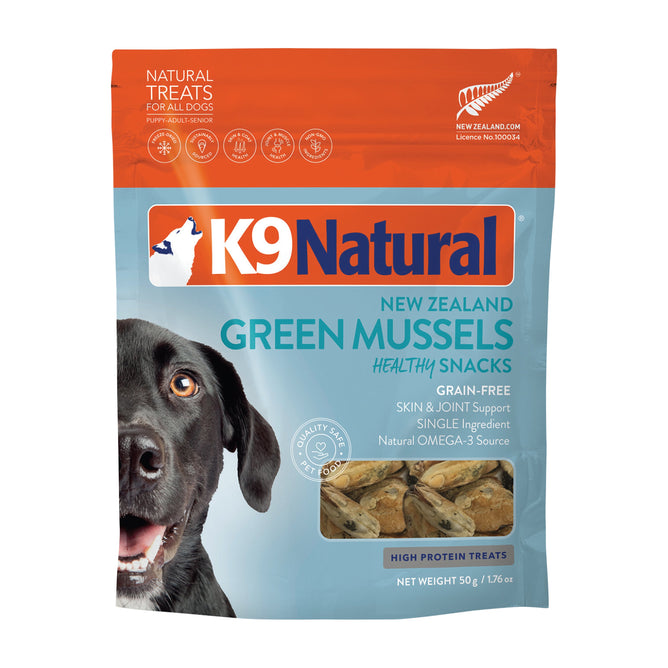 K9 Natural Grain-Free Freeze-Dried Dog Treats with New Zealand green mussels come in orange and blue packaging, featuring a dog photo. These treats are high in protein, grain-free, and rich in Omega-3 for skin and joint support.