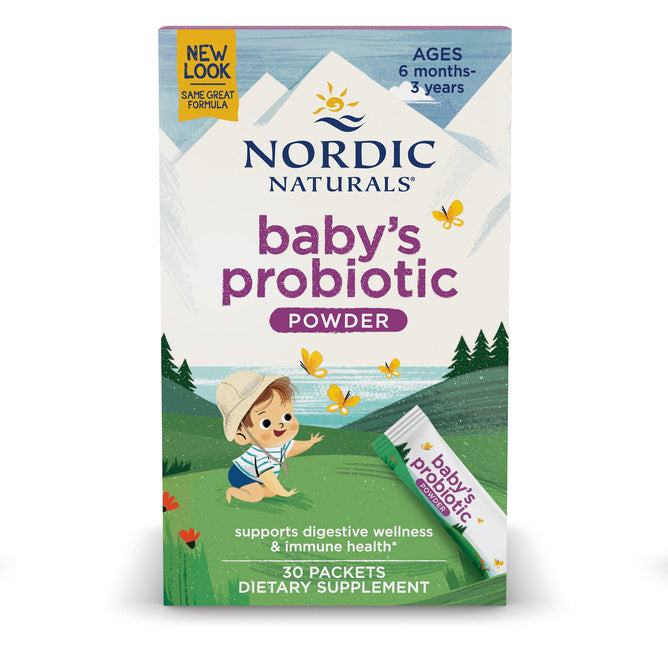 A box of Nordic Naturals Nordic Flora Babys Probiotic Powder for ages 6 months to 3 years features a charming illustration of a baby in a hat among green hills and yellow butterflies. It provides digestive support with beneficial probiotic strains and includes a sachet supplement.